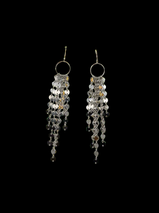 Sparkling Round Sterling Silver Discs Delicately dangle from a center circle, on drop earrings.
