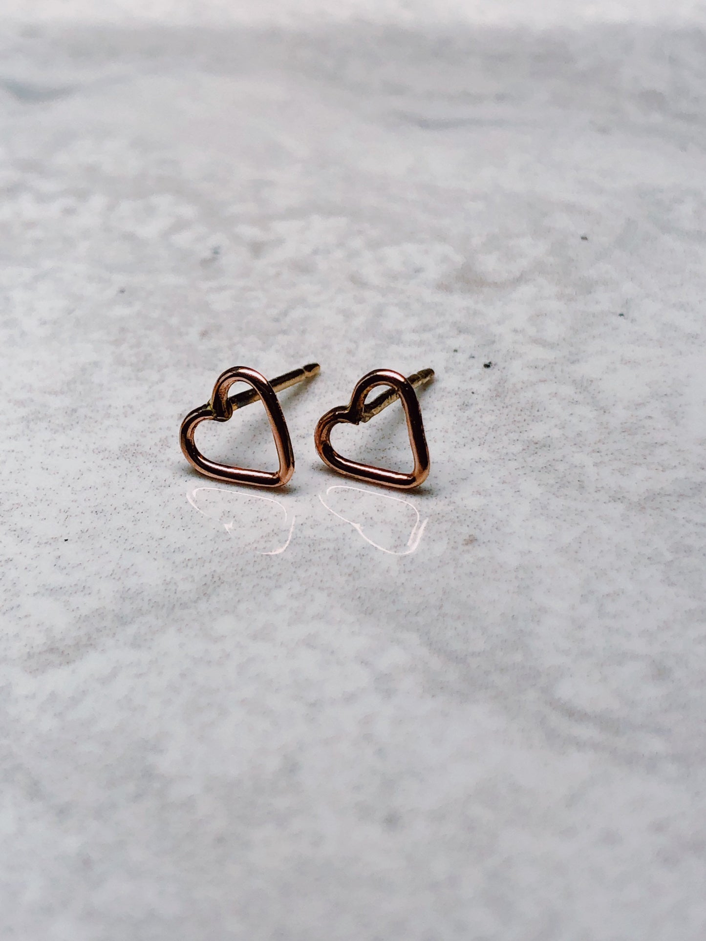 open heart earrings in 14k gold