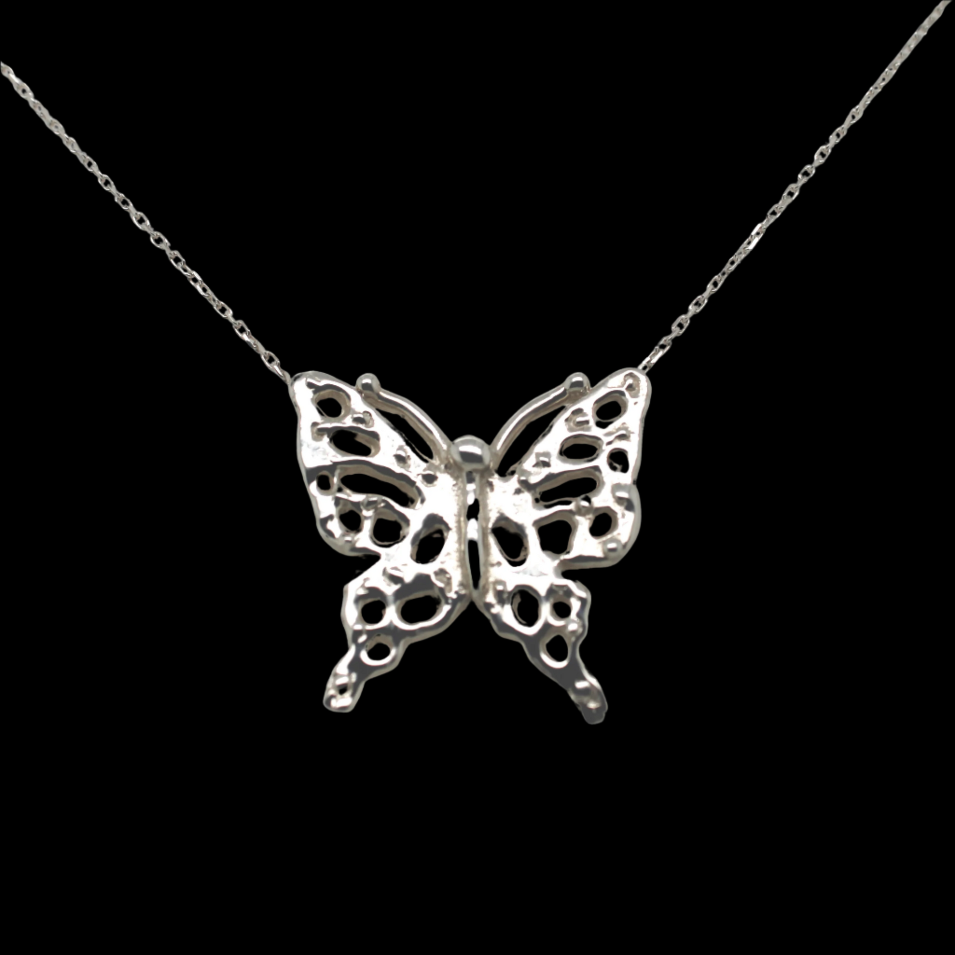 Delicate sterling silver butterfly pendant necklace with intricate openwork design, displayed on a fine silver chain against a black background.