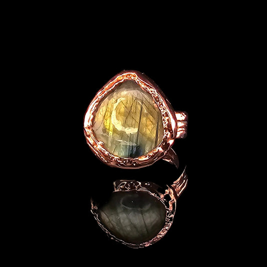 Faceted teardrop labradorite ring handcrafted in polished electroformed copper with natural organic texture.